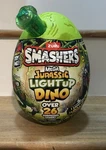 Zuru Smashers Mega Jurassic Light Up & Roar Dino, 26 Surprises Inside New. Price: $19.00.