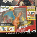 Jazwares PKW4262 Pokemon 6" Interactive Charizard Deluxe Figure W/2" Pikachu New. Price: $30.00.