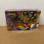 Teenage Mutant Ninja Turtles Chopper Cycle With Rocksteady Action Figure Set New. Price: $23.00.