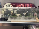 Accoutrements Glow The Dark Flesh Eating Zombies Figures Playset - Open Box Used. Price: $20.00.