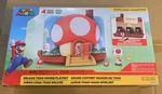 New World Of Nintendo Super Mario Deluxe Toad House Playset W/ 2.5" Figure. Price: $27.00.