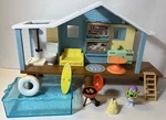 Moose Toys 17551 Bluey Beach Cabin Playset, With Exclusive Figure Goggles. Used. Price: $29.91.