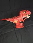 Red T-rex Dinosaur Toy. Electronic Walking Light Up Sound Figure Used. Price: $12.00.