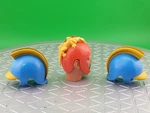 1976 Mego 2 Flash Gordon Helmets And Red Ming With Lizard Used. Price: $32.55.