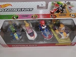 Mariokart Set Of 4 Racing Cars From Hot Wheels. Includes Mario, Yoshi, Peach New. Price: $22.99.