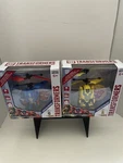 Two, World Tech Toys: Transformer Bumblebee/ Optimus Prime. Helicopters New SET2. Price: $29.99.